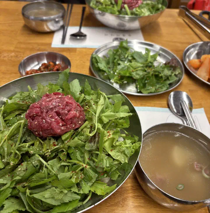 1++ Korean beef tartare over fresh water dropwort, the base of Neungdong yukhoe bibimbap