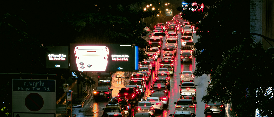 Heavy traffic during the evening commute on a rainy city street