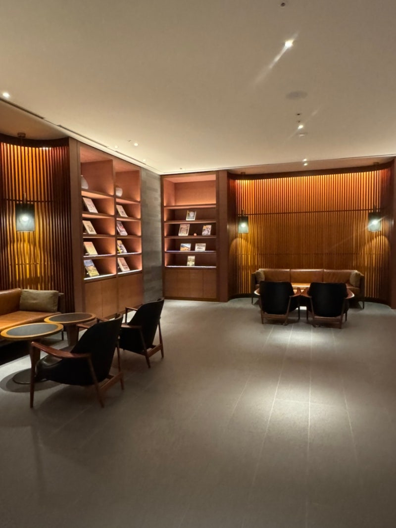 Cozy reading nook with bookshelves and sofas at Eternal Journey bookstore