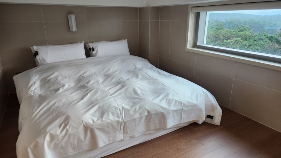 Gijang sea view through the long window beside the bed