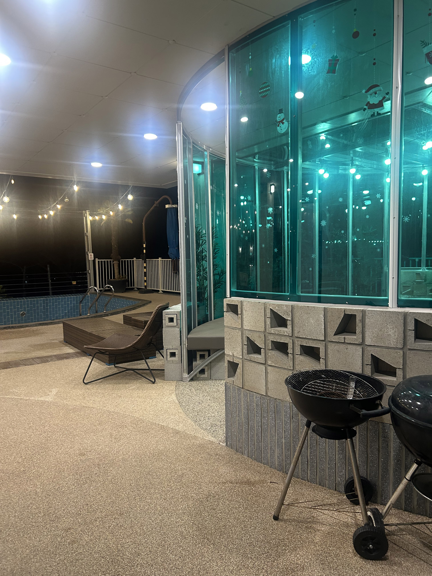 Villa de Himmel communal pool lit up at night