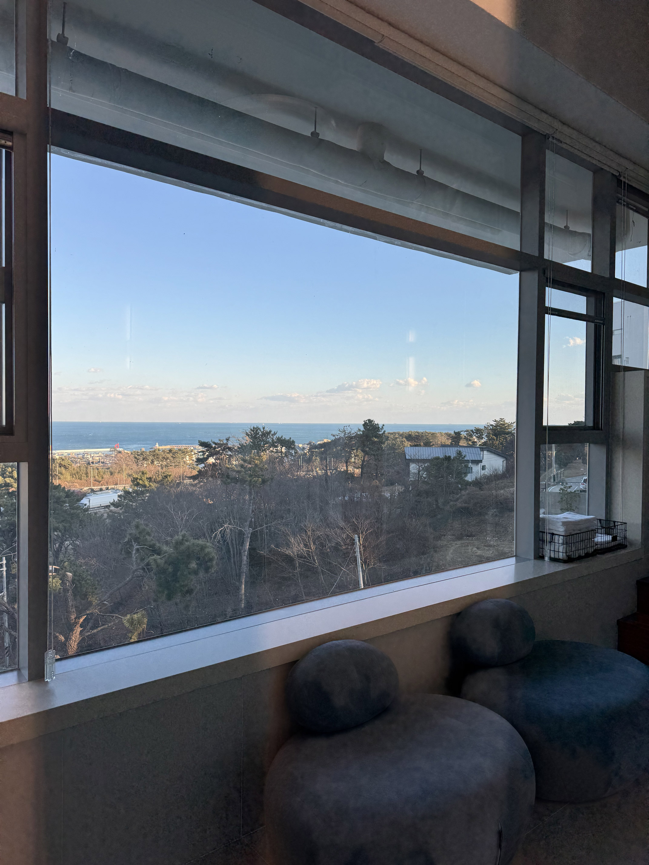 Living room window at Villa de Himmel framing the Gijang ocean view