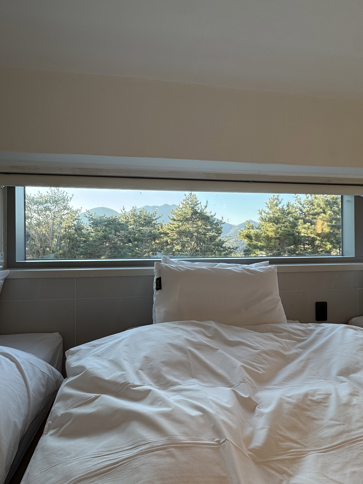 Loft bedroom with hotel-grade bedding at Villa de Himmel