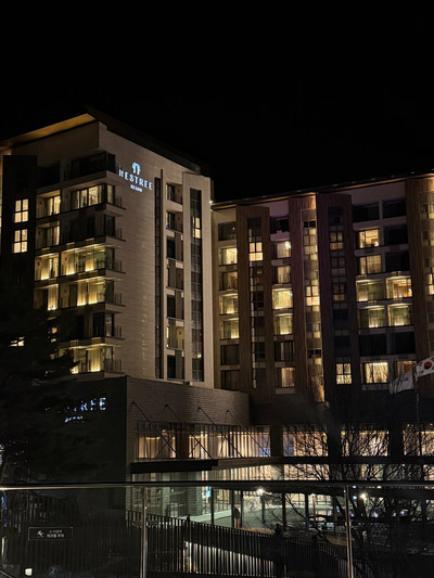 The illuminated Forest Resom Restri tower lit up at night