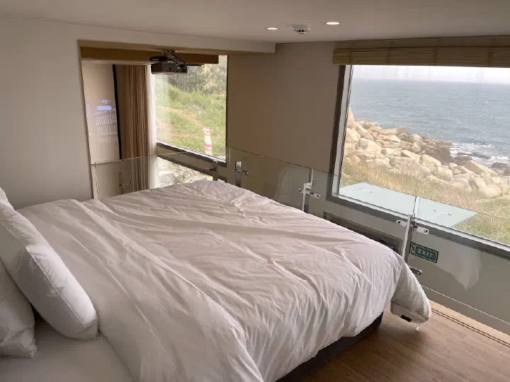 Master bedroom with ocean view at Ocean Bliss - upper floor of the pool villa
