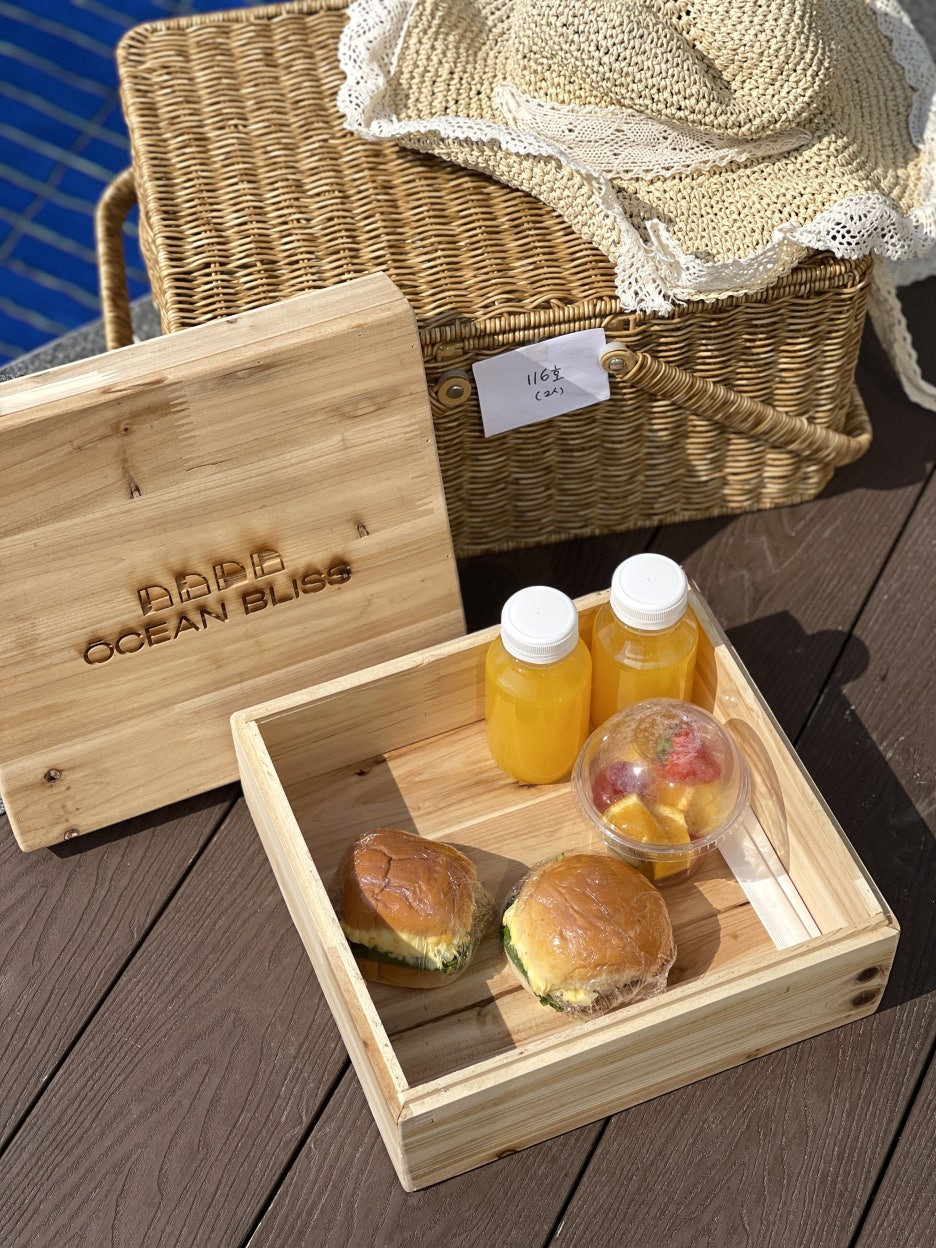 Ocean Bliss breakfast basket - sandwich, fruit, and juice delivered to the villa