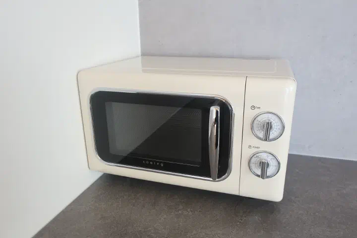 Mini kitchen with retro-style microwave and fridge at Ocean Bliss villa