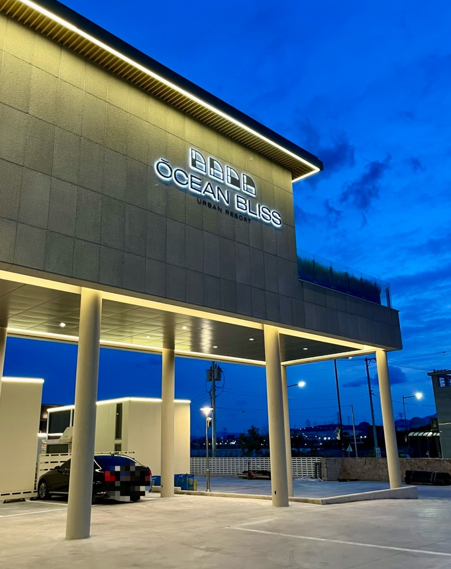 Ocean Bliss Urban Resort at night - illuminated new-build resort exterior