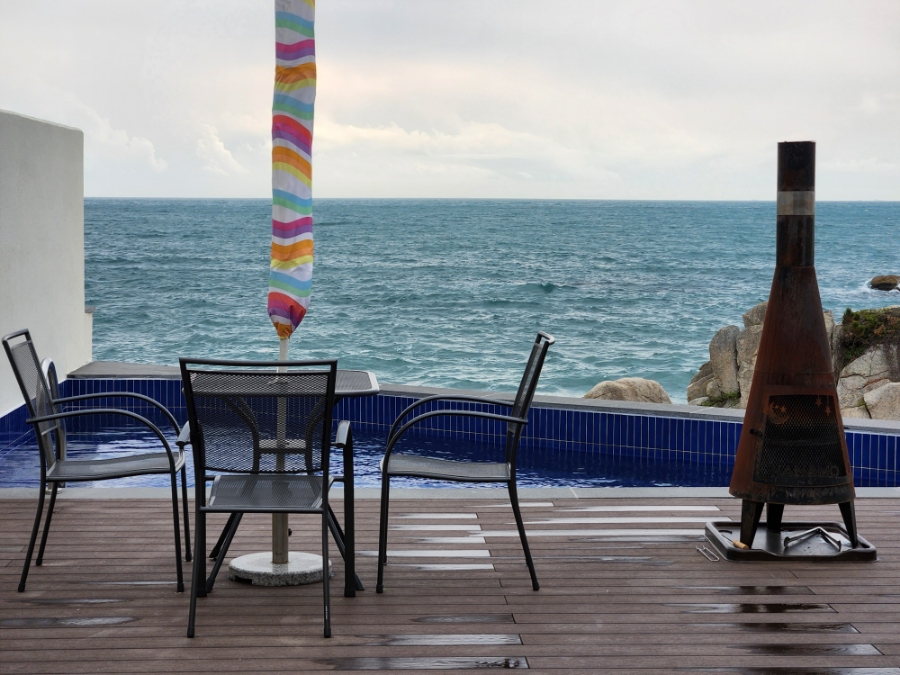 Outdoor terrace with fire pit and private pool at Ocean Bliss villa