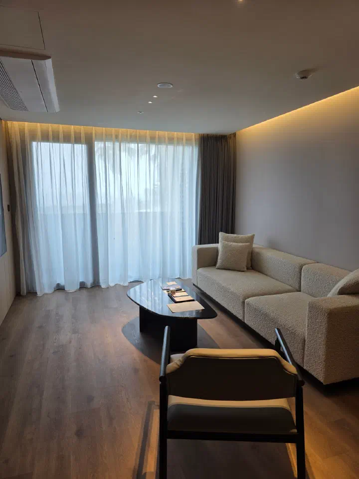 Newly renovated wood-toned living room in a Haevichi Resort Jeju suite