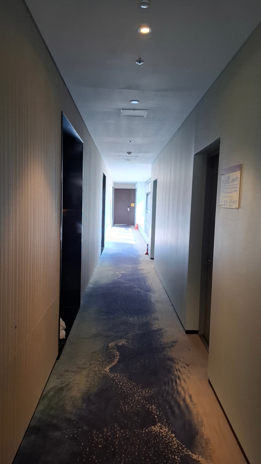 Tanibay Hotel guest floor corridor with ocean wave pattern carpet
