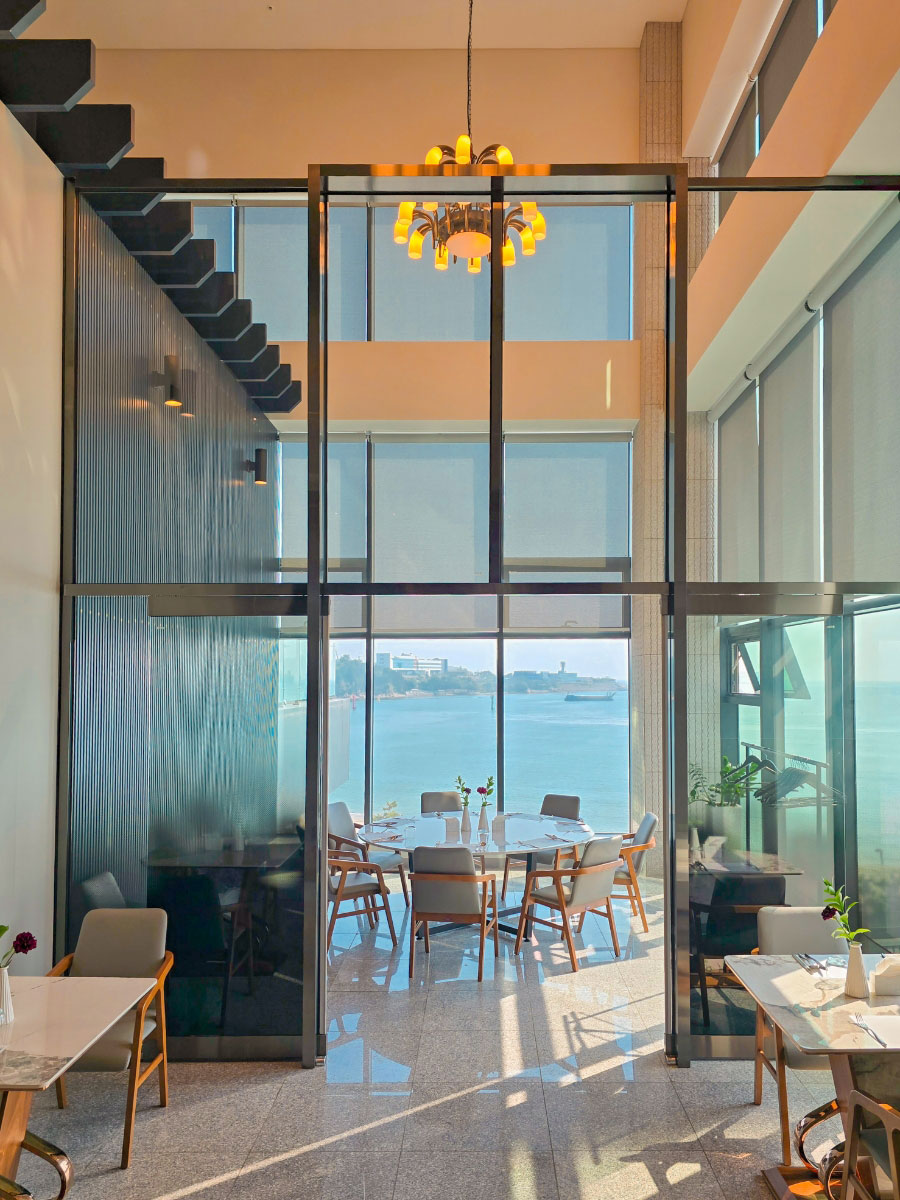 Saehae restaurant interior with high ceiling and ocean view
