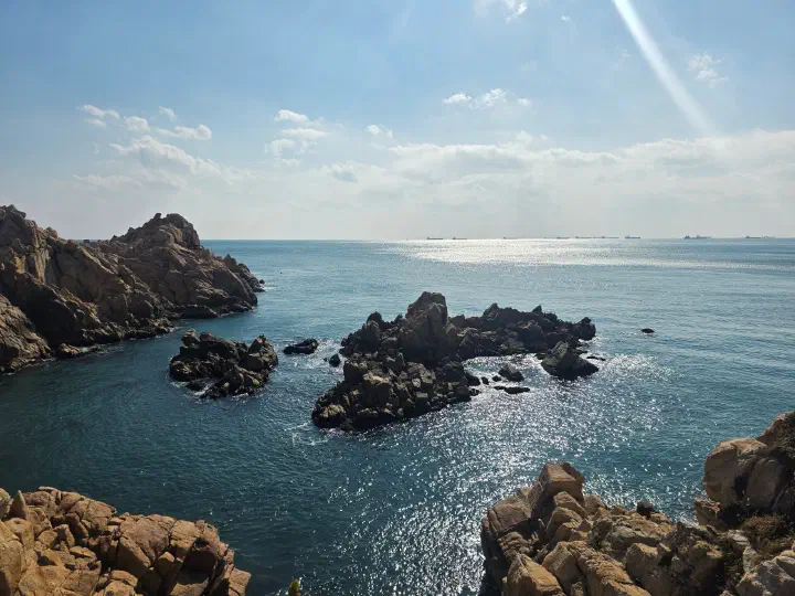 Small islets and deck path along the northern Daewangam coast