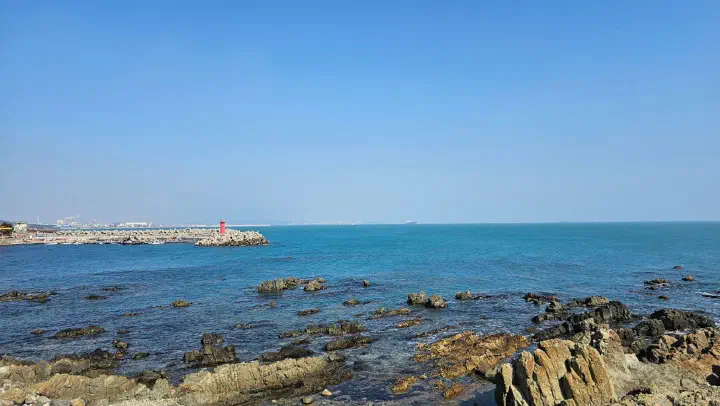 The wide-open East Sea coastline seen from Ganjeolgot, Ulsan