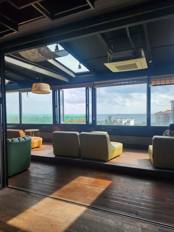 An ocean-view café at Ganjeolgot with the sea through the window