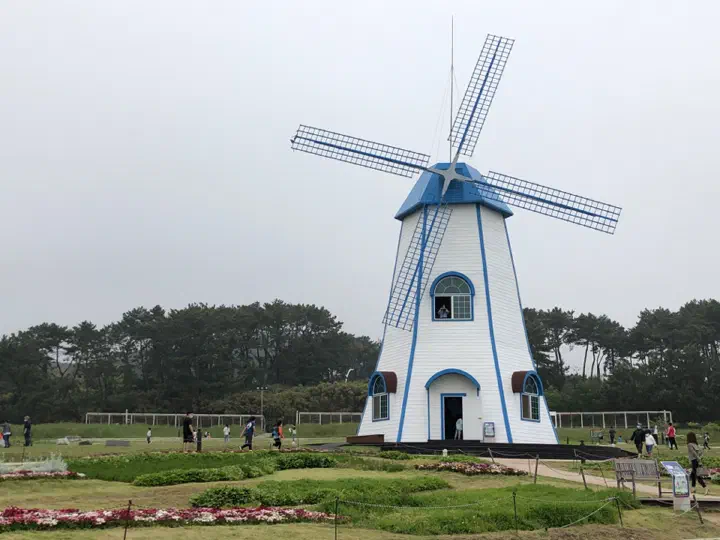 The white windmill by the sea at Ganjeolgot